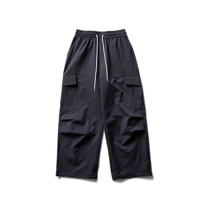 Unisex Weite Cargo-Utility-Hose im Baggy-Schnitt mit elastischem Kordelbund und großzügigen Klappentaschen Echoarchiv