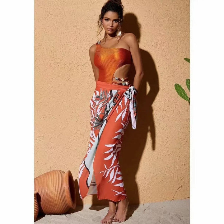 Damen Einteiler Badeanzug mit asymmetrischem Schnitt und floralem Wickelrock Echo Archiv