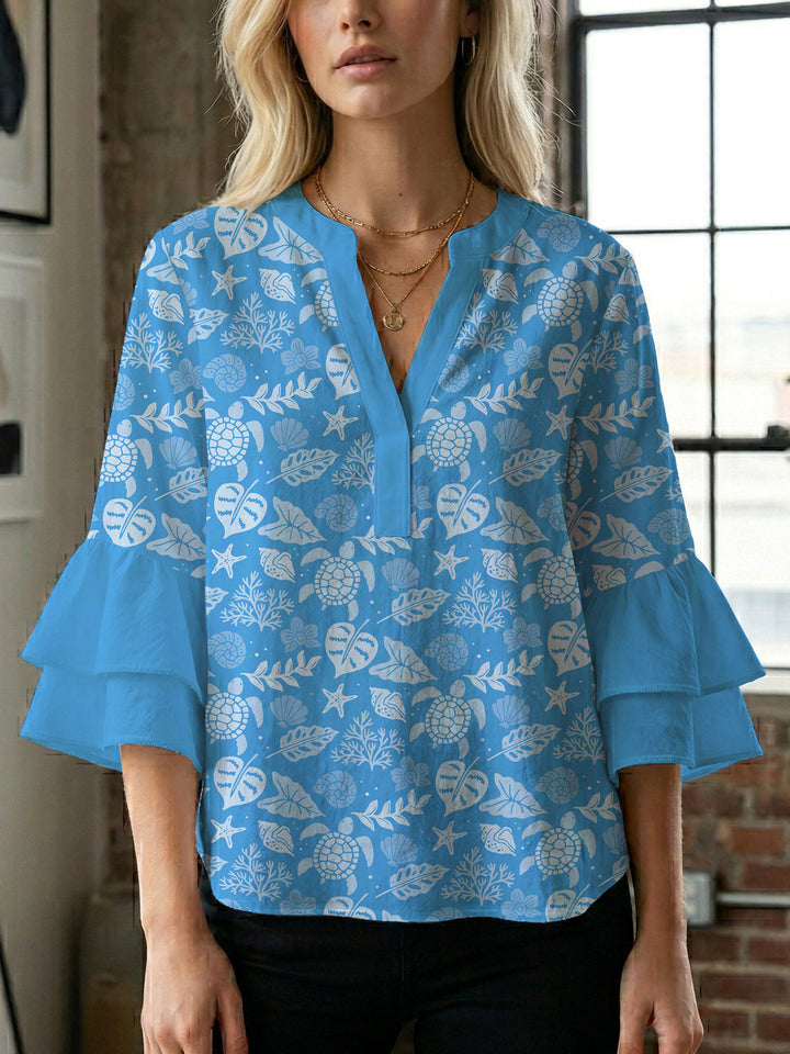 Damen Bluse mit voluminösen Rüschenärmeln und modernem Motiv Echo Archiv
