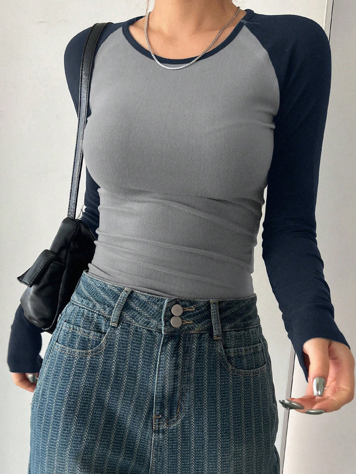 Damen Langarmshirt mit Kontrastärmeln und figurbetontem Schnitt Echo Archiv