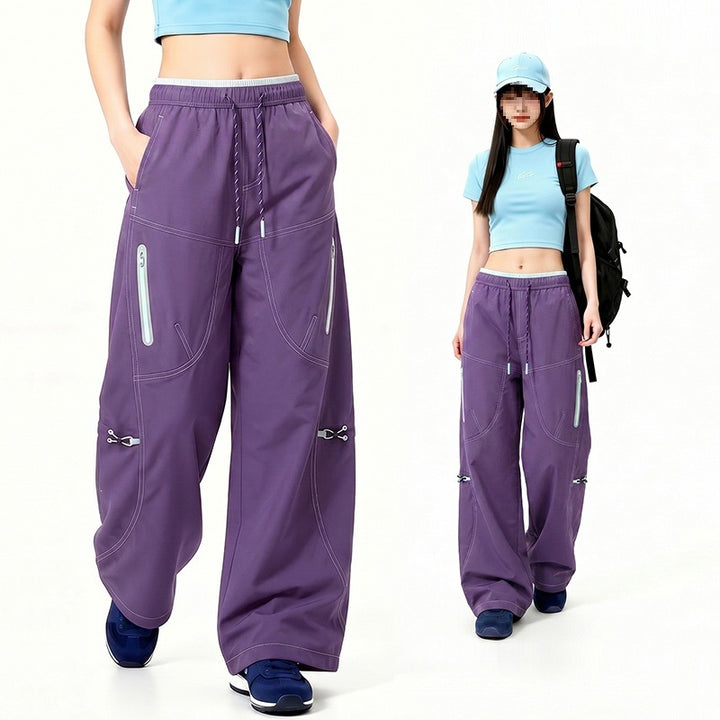 Damen Oversize Tech-Loungehose mit Kontrastnähten, reflektierenden Reißverschlusstaschen & Kordelbund Echoarchiv