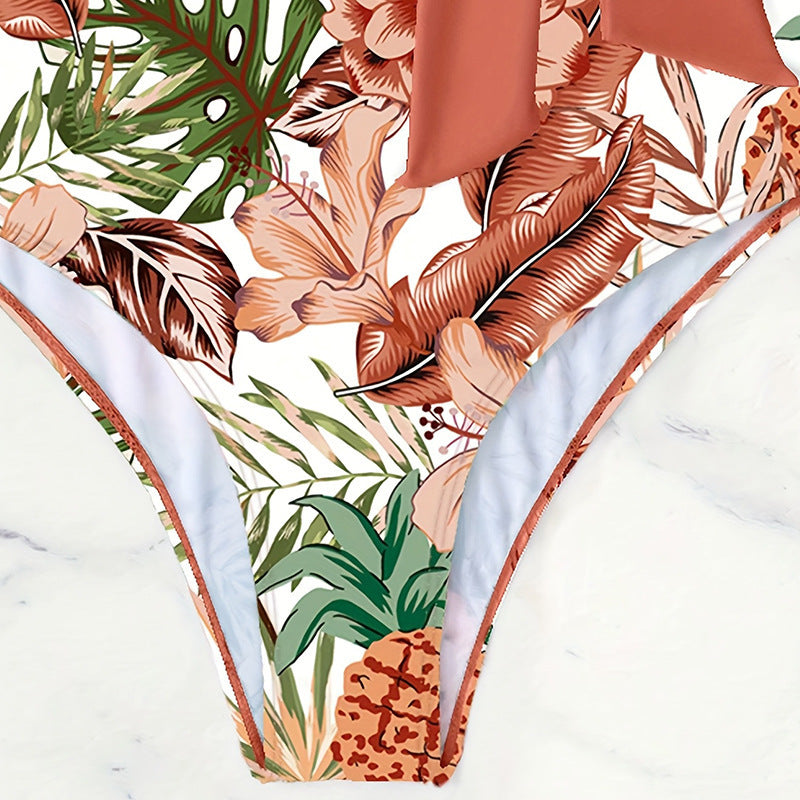 Damen Einteiler Badeanzug mit floralem Wickeldesign und dekorativer Schleife Echo Archiv
