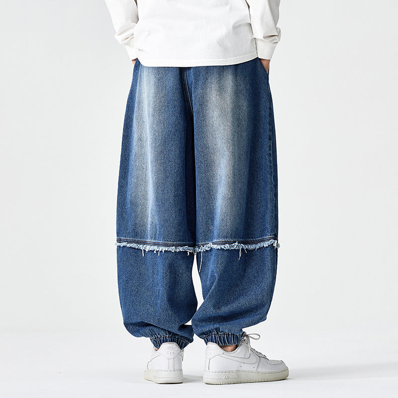 Herren Weit geschnittene Baggy-Denim-Hose mit Tunnelzug, elastischen Beinabschlüssen und Fransen-Detail Echo Archiv