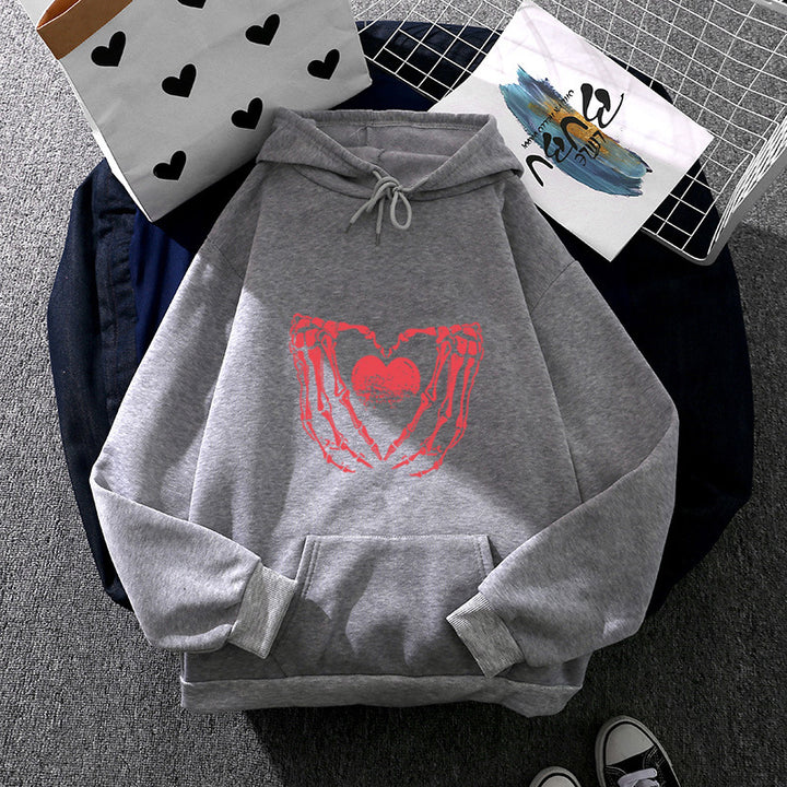 Damen stylischer Kapuzenpullover mit Skeletthand Herzmotiv und Kängurutasche – Auréline