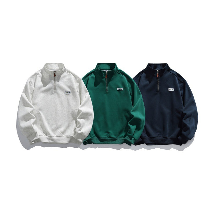 Unisex Halbzip-Sweatshirt mit Stehkragen, Raglanärmeln und minimalistischer Brustpatch Echoarchiv