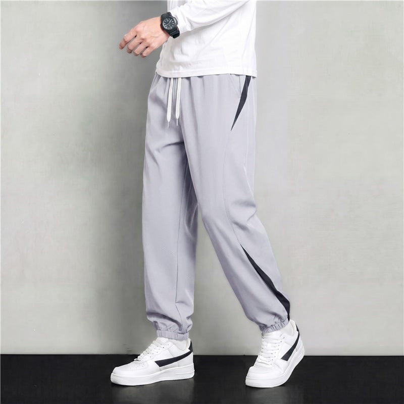 Herren Athleisure Jogginghose im Baggy‑Schnitt mit elastischem Bund, Tunnelzug und seitlichen Kontrastkeilen Echoarchiv