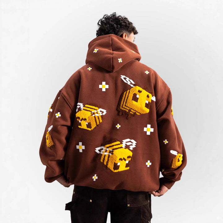 Unisex nan Kapuzenpullover mit eingestricktem Pixel-Bienenmotiv und aufgesetzter Kängurutasche Echoarchiv