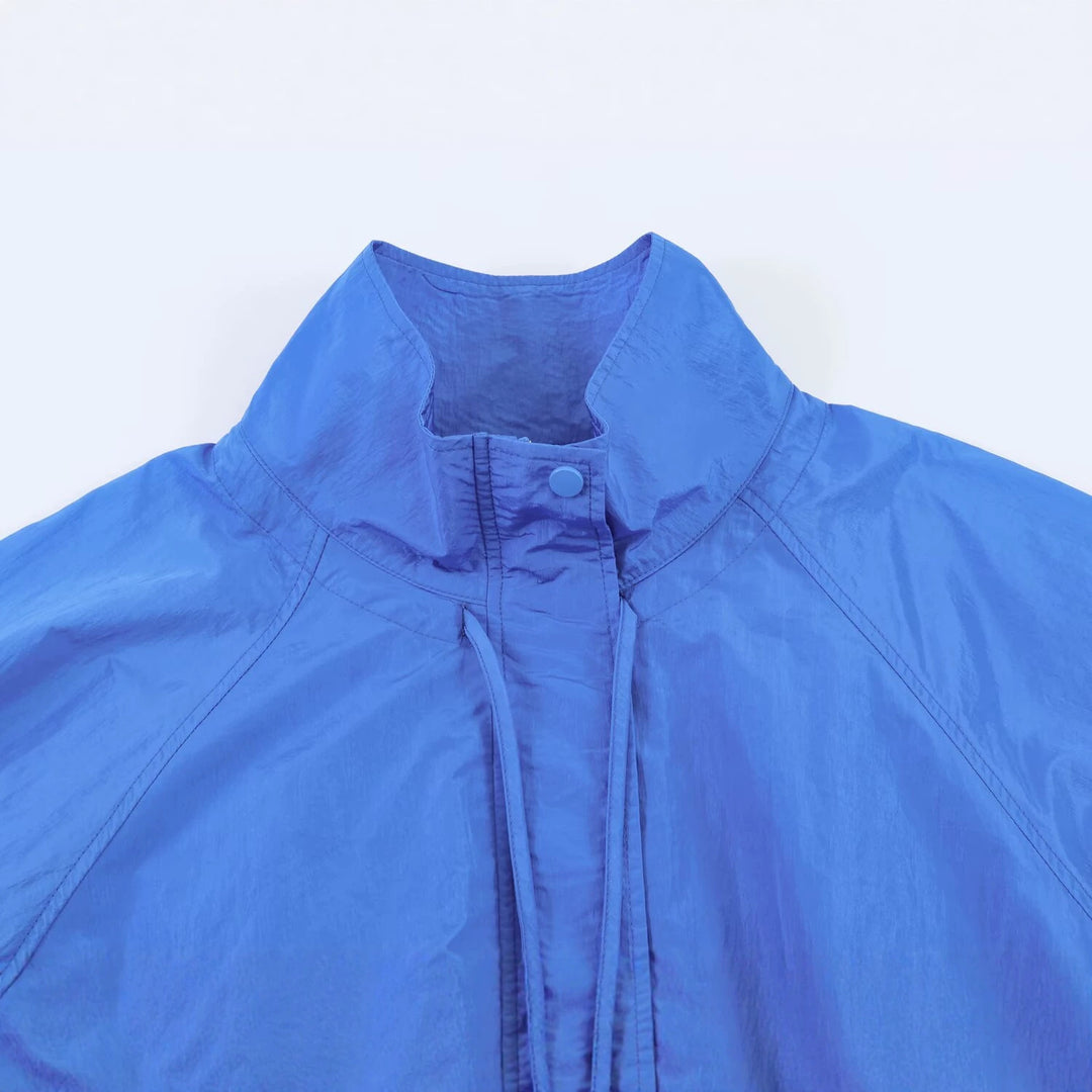Damen Leichte Windbreakerjacke mit hohem Stehkragen, Tunnelzugsaum und Raglanärmeln Echo Archiv