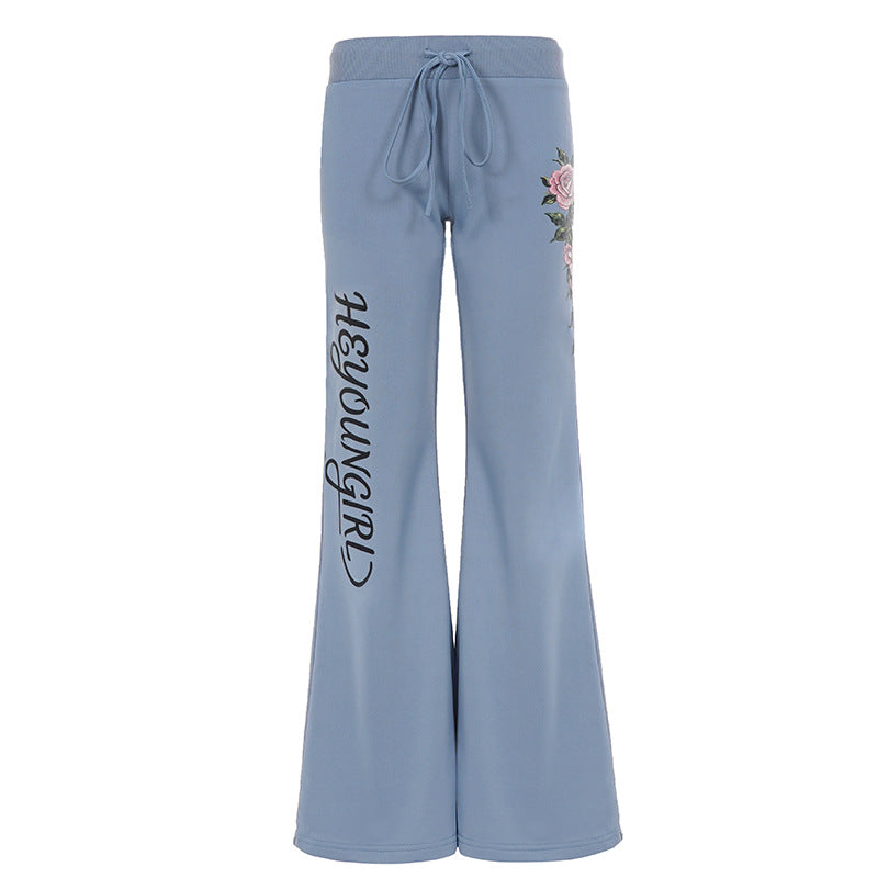 Damen nan ausgestellte Jersey-Sweathose mit Kordelzug, floralem Seitenprint und Statement-Schriftzug Echo Archiv