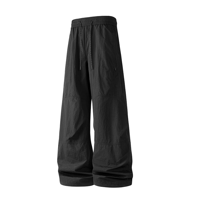 Herren Weite Baggy‑Hose mit Tunnelzugbund und Paneel‑Konstruktion Echo Archiv