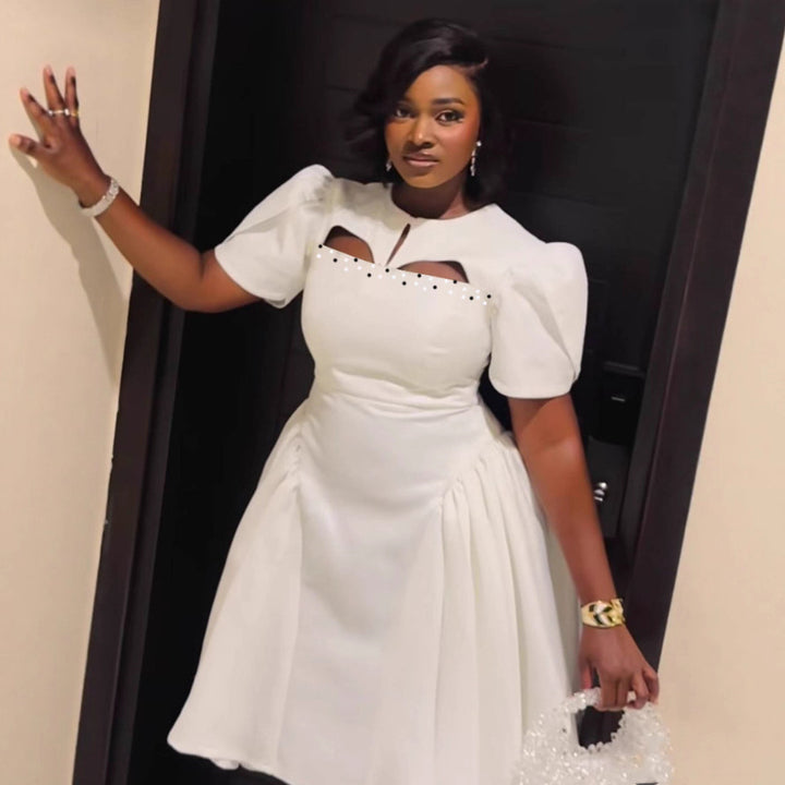 Damen Kleid mit eleganten Puffärmeln und raffinierten Cut-Outs Echo Archiv