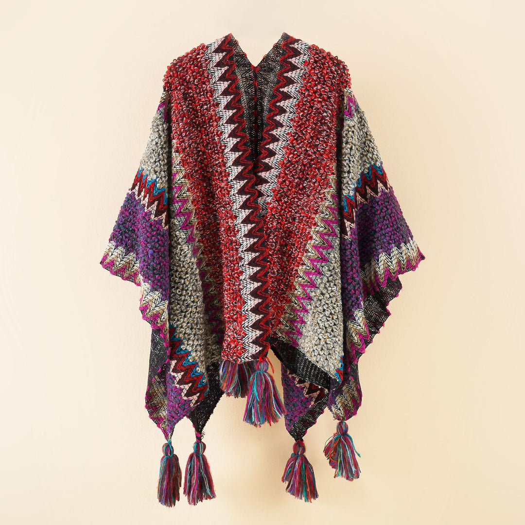 Damen Kurzponcho aus Bouclé-Strick mit Zickzack-Jacquard und Quasten – Avérine