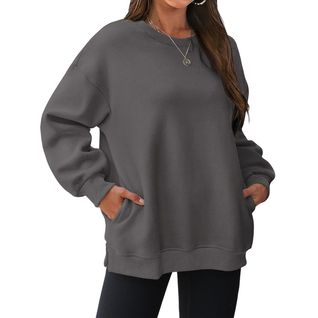 Damen verlängertes Oversize Rundhalspullover mit seitlichen Eingrifftaschen, Rippbündchen und überschnittener Schulter – Mavelle