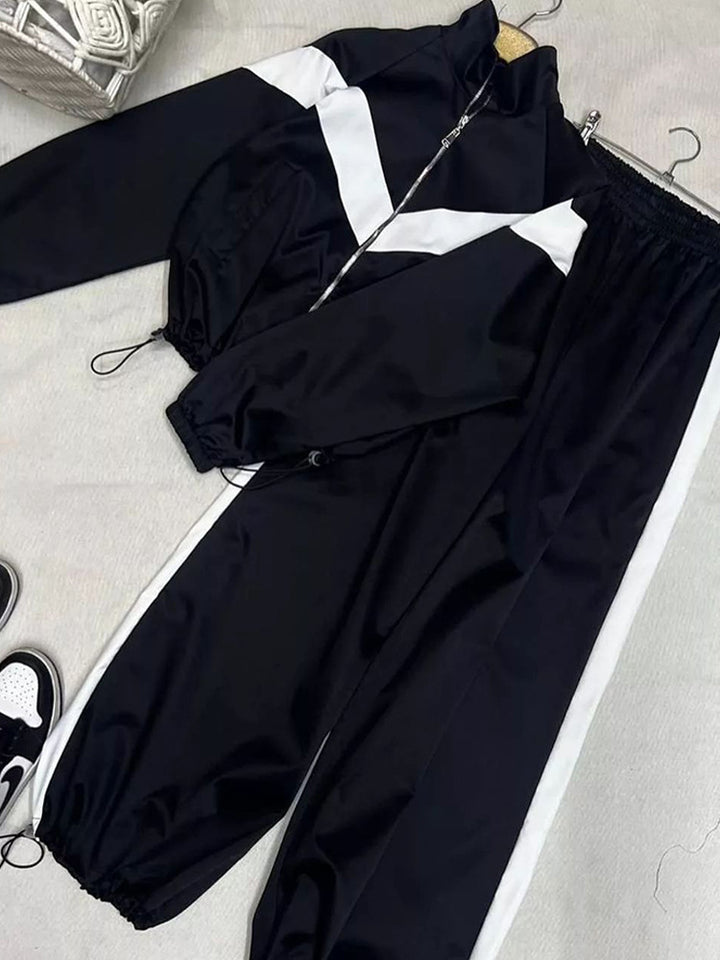 Damen tailliertes Zip-Trainingsset mit Chevron-Einsatz, Kordelzugsaum und hochgeschnittener Jogginghose – Avérine