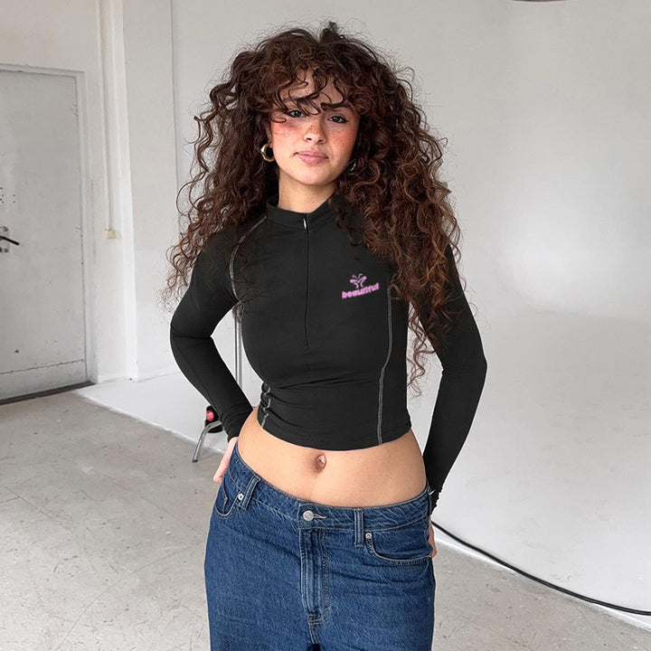 Damen Sportliches tailliertes Langarm-Performance-Shirt mit kurzem Frontreißverschluss – Avérine