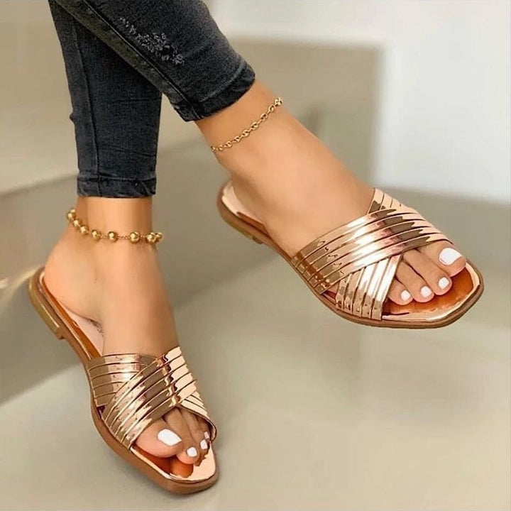 Damen Geflochtene Metallic-Slipper mit überkreuzten Riemen und flacher Komfortsohle – Lioré