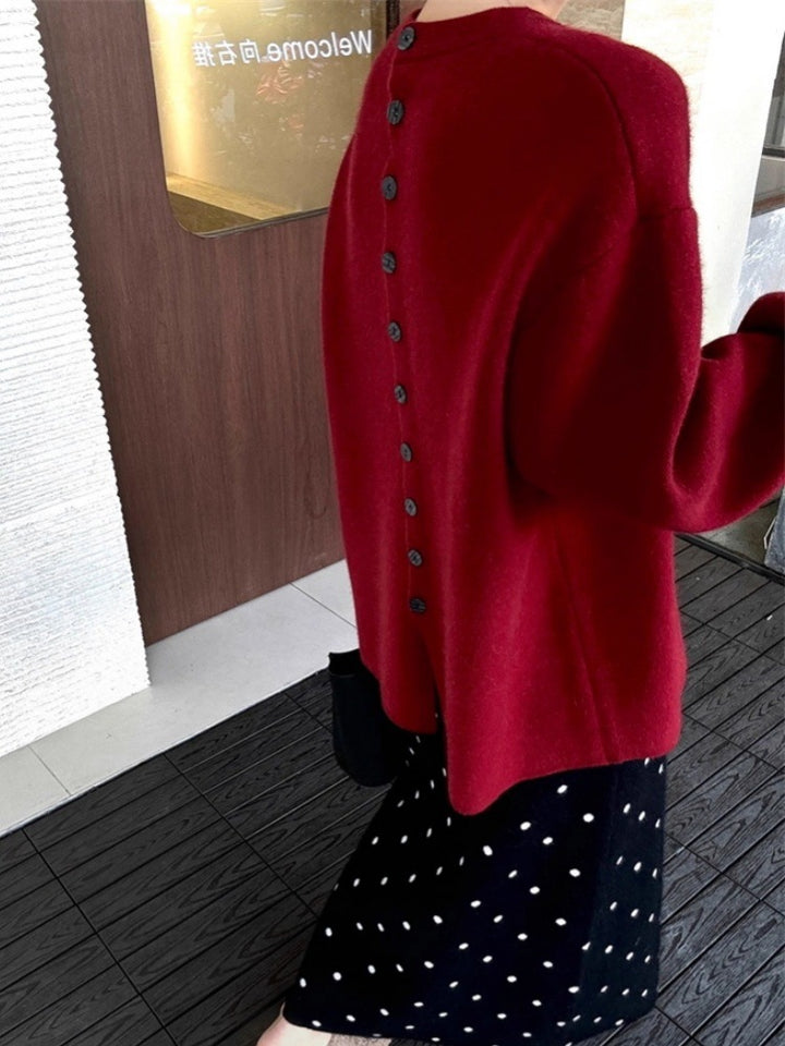 Damen Oversize-Feinstrickpullover mit Ballonärmeln und Knopfmanschette Echoarchiv