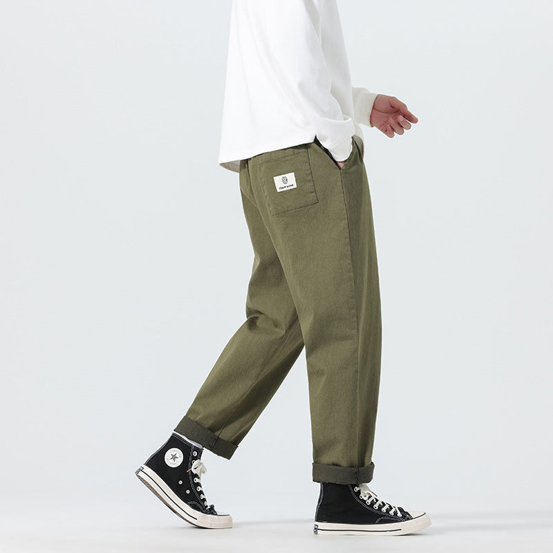 Herren Locker geschnittene Cropped-Denimhose mit Umschlag und Label-Patch Echo Archiv