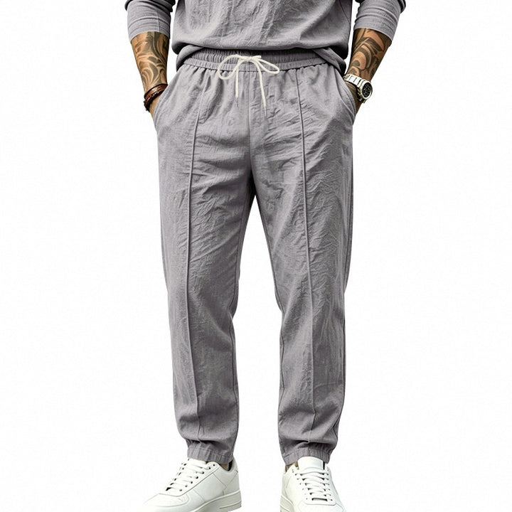 Herren Leichte Tapered-Jogginghose mit Bundfalten, elastischem Tunnelzug und Seitentaschen Echoarchiv