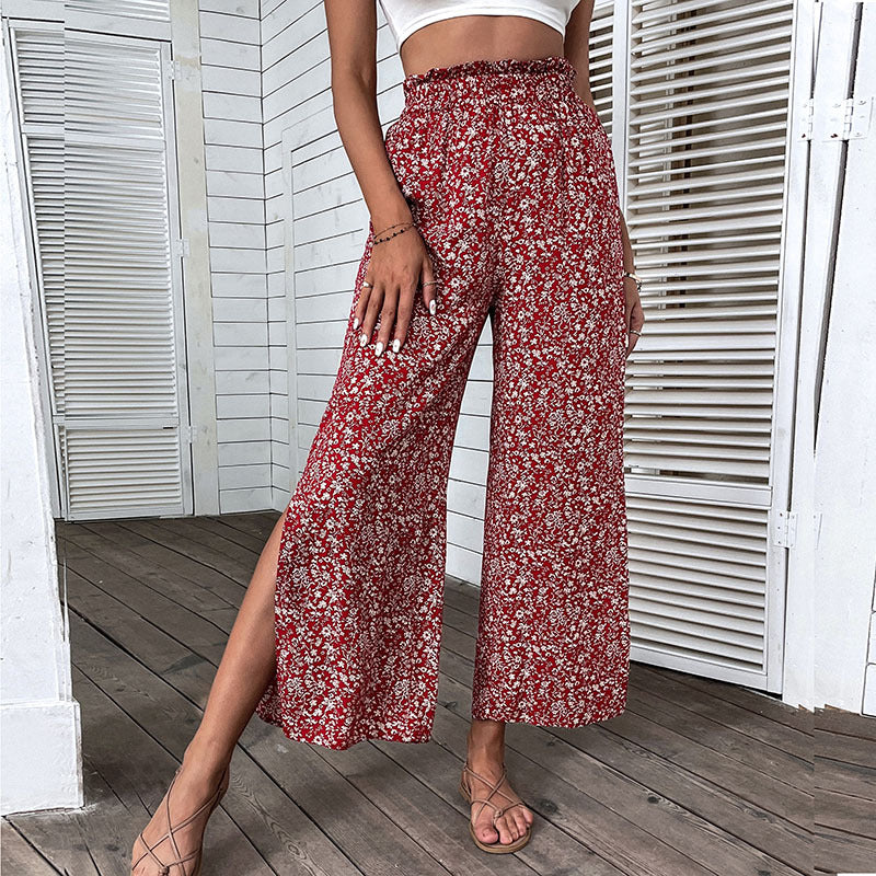 Damen Weite hochgeschnittene Palazzo‑Hose mit floralem Muster und seitlichem Beinschlitz Echoarchiv