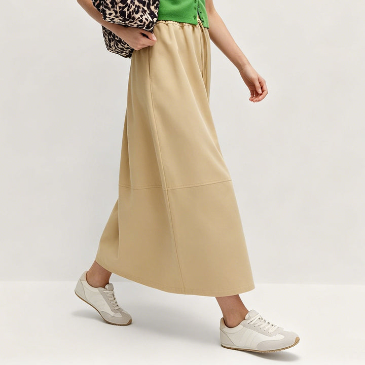 Damen Midirock mit elastischer Tunnelzug‑Taille, Eingrifftaschen und sportiver A‑Linie – Avérine
