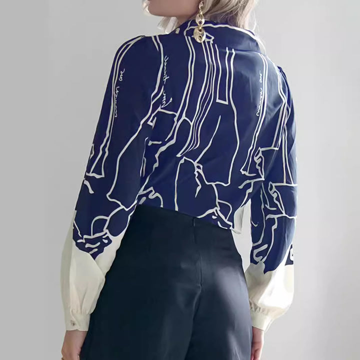 Damen V-Ausschnitt-Bluse mit abstraktem Grafikprint, Ballonärmeln und kontrastierenden Manschetten – Avérine
