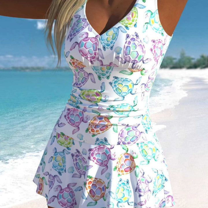 Damen Schwimmdress mit fröhlichem Schildkrötenmotiv und elegantem Rocksaum Echo Archiv