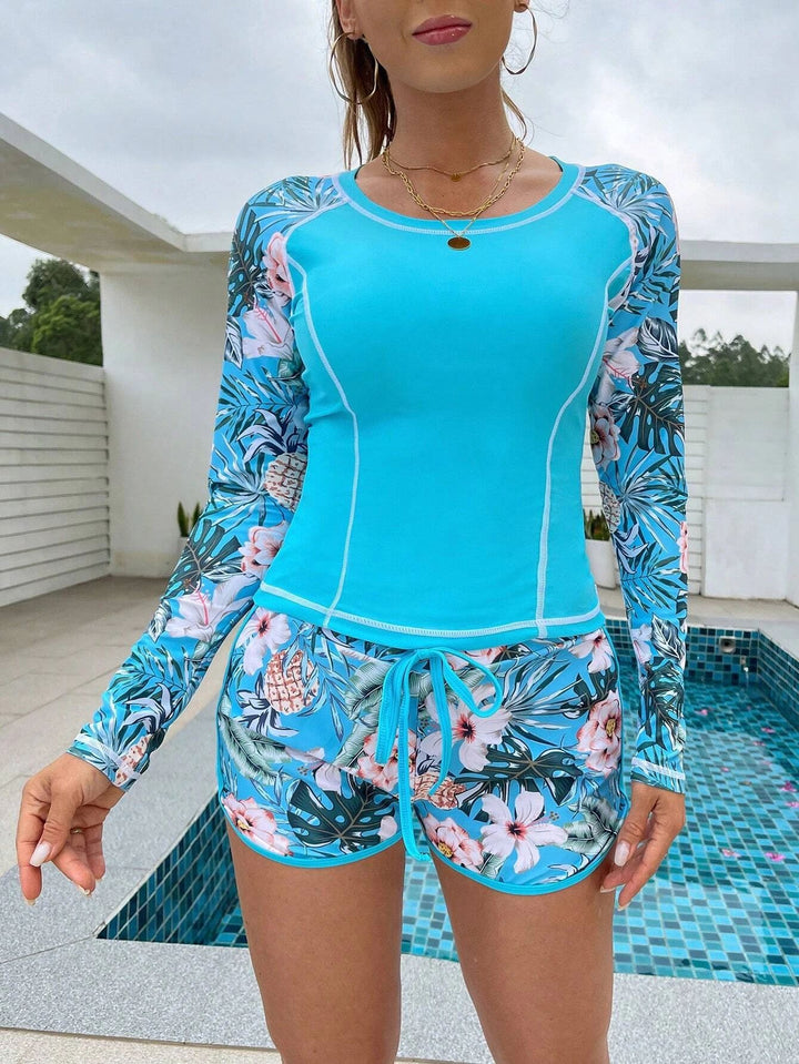 Damen Langarm Surf-Badeanzug mit floralem Muster Echo Archiv