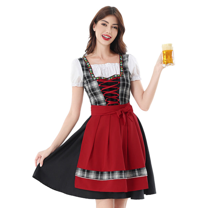 Damen nan traditionelles Dirndlkleid mit kariertem Mieder, Schnürung, Puffärmeln und Schürze Echo Archiv