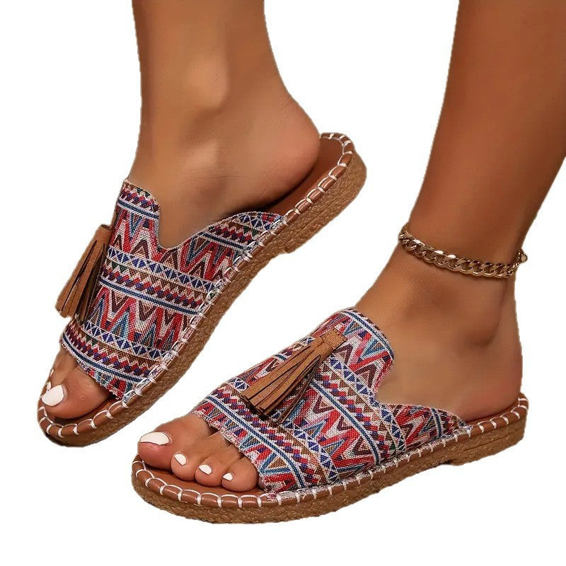 Damen Ethno-Slipper-Sandalen mit Quaste und handgenähter Ziernaht – Sorelia