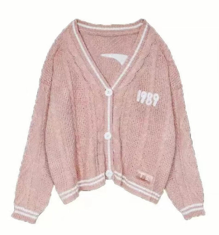 Damen nan kurz geschnittene Strickjacke mit V-Ausschnitt, Kontrastpaspel und oversized Ärmeln Echo Archiv