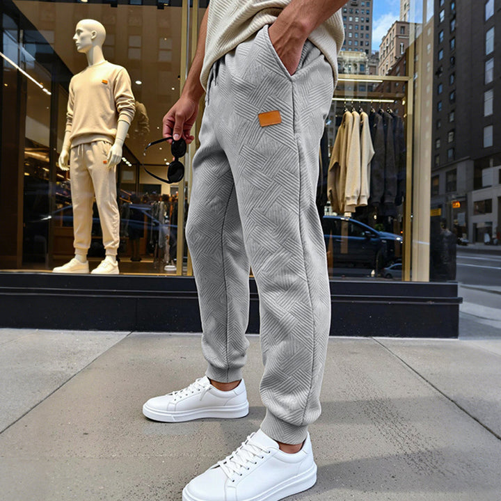 Herren Stepp-Jogginghose mit geometrischem Strukturmuster Echoarchiv