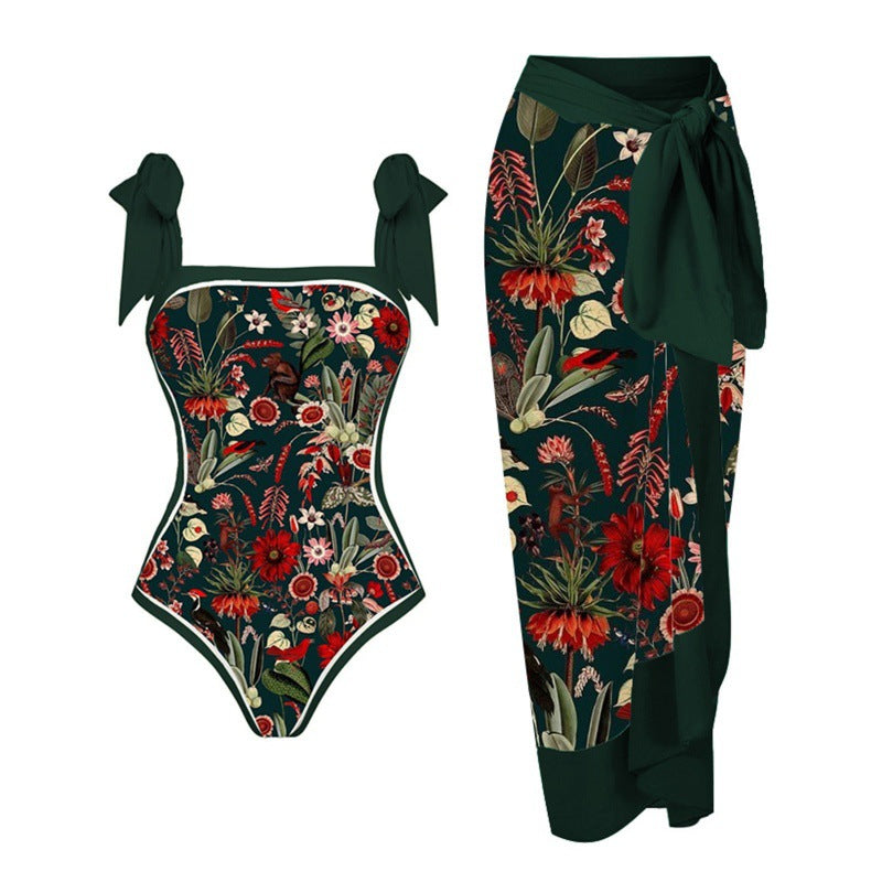 Damen Einteiler Badeanzug mit elegantem Wickelrock und modischen Riemen Echo Archiv