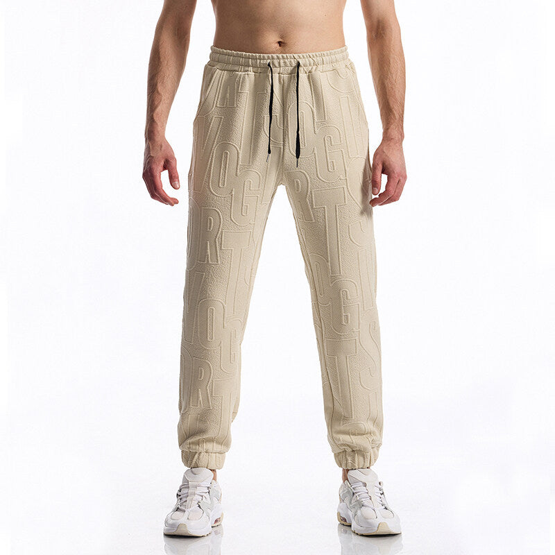 Herren Jogginghose mit elastischem Bund, Tunnelzug und geprägtem Allover‑Logo‑Relief Echo Archiv