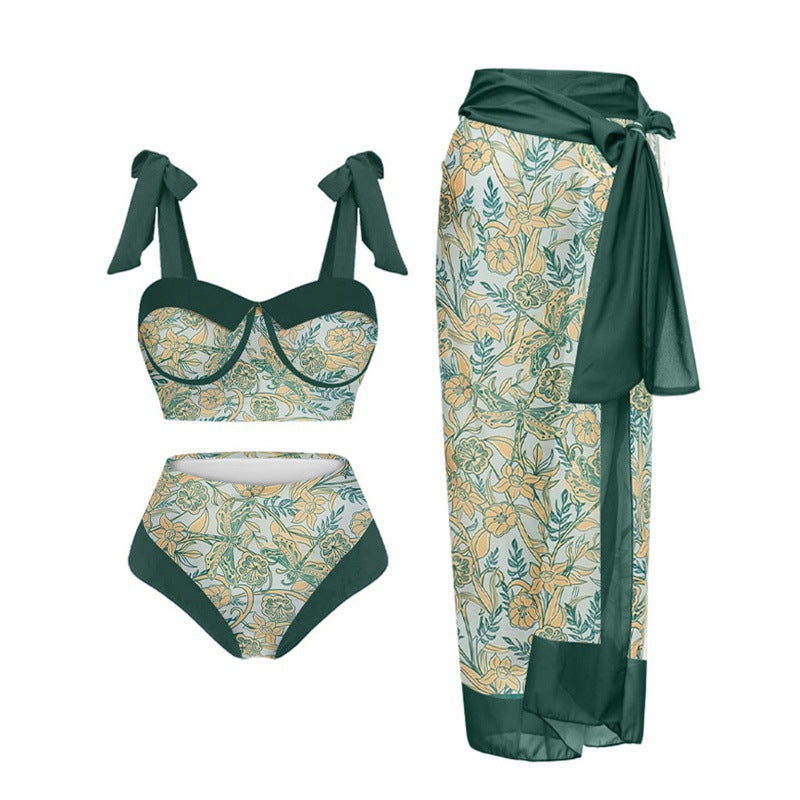 Damen Einteiler Badeanzug mit elegantem Wickelrock und modischen Riemen Echo Archiv