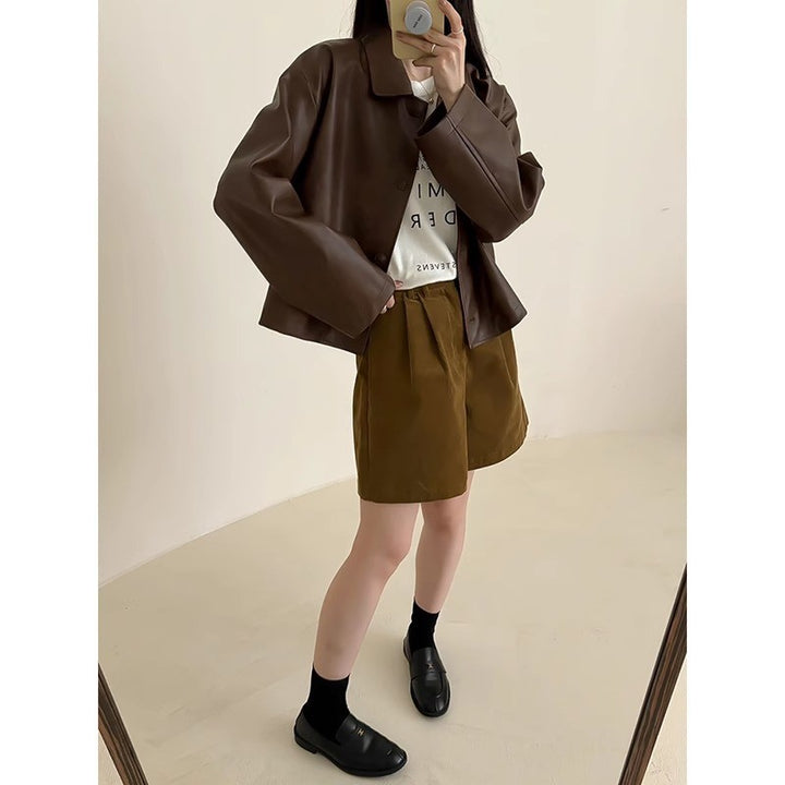 Damen Boxy‑Kunstleder‑Hemdjacke mit verdeckter Knopfleiste und überschnittenen Schultern Echoarchiv