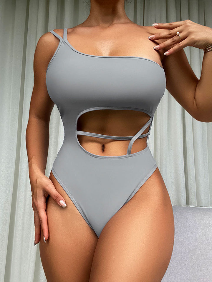 Damen Einteiliger Badeanzug mit asymmetrischem Schnitt und trendigen Cut-Outs Echo Archiv