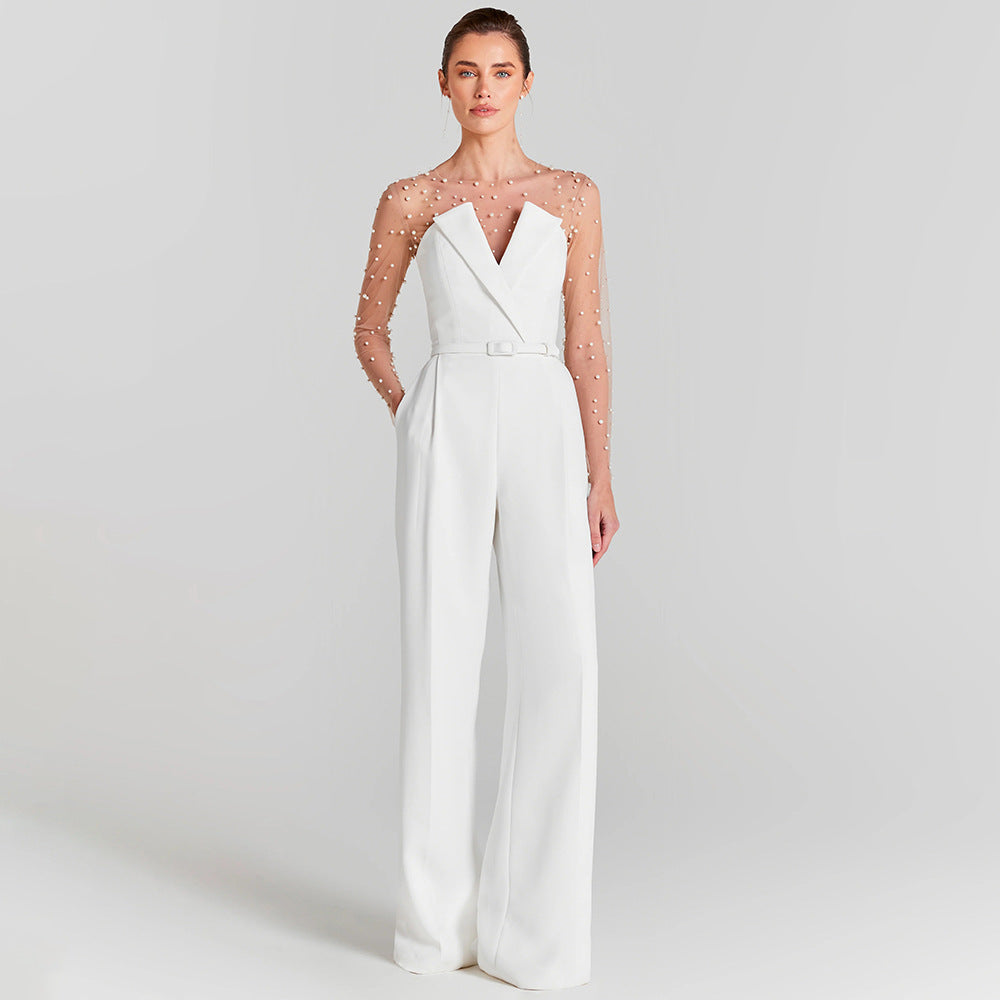 Damen eleganter Jumpsuit mit transparenten Ärmeln und Perlenverzierung Echo Archiv