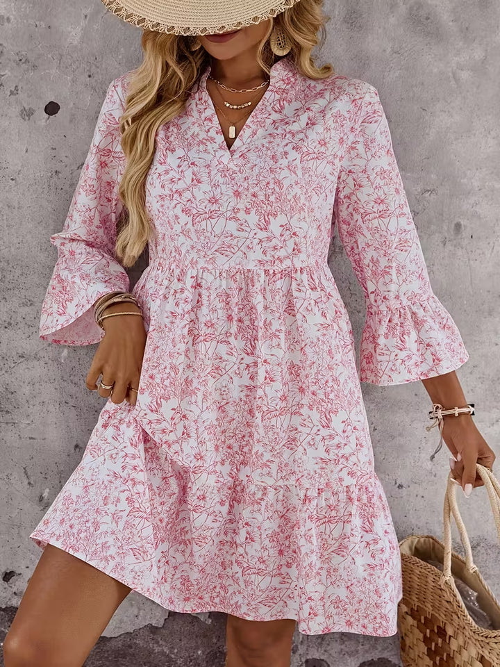 Damen Florales Babydoll-Kleid mit V-Ausschnitt, hohem Empire‑Bund und Glockenärmeln Echo Archiv