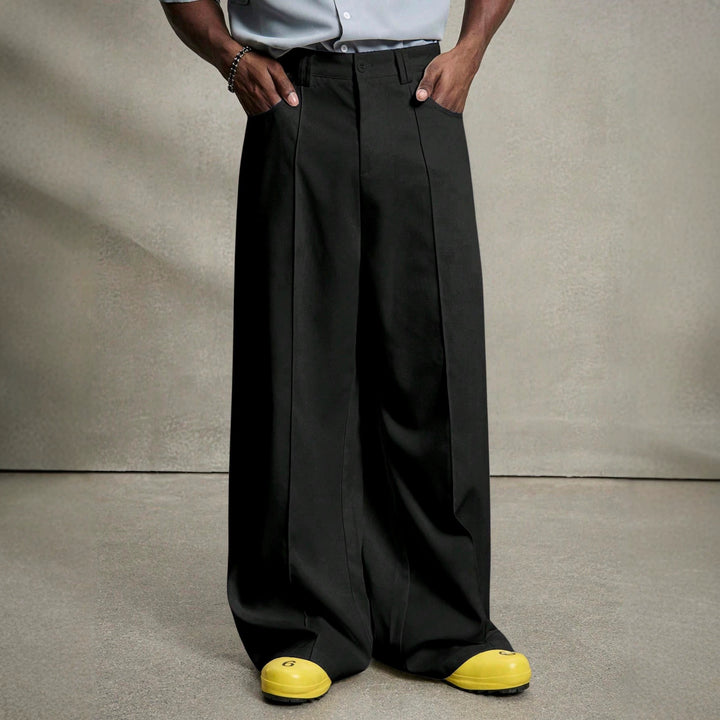 Herren nan weite Bundfaltenhose mit hoher Bundhöhe, präzisen Bügelfalten und seitlichen Eingrifftaschen Echo Archiv