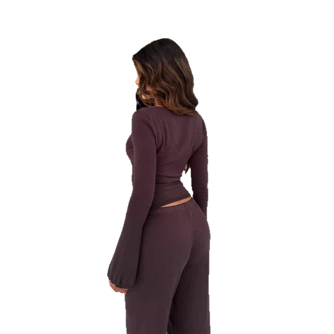 Damen nan Strick-Wickeloberteil mit Bindegürtel und Trompetenärmeln sowie taillenhoher weitgeschnittener Strickhose Echo Archiv