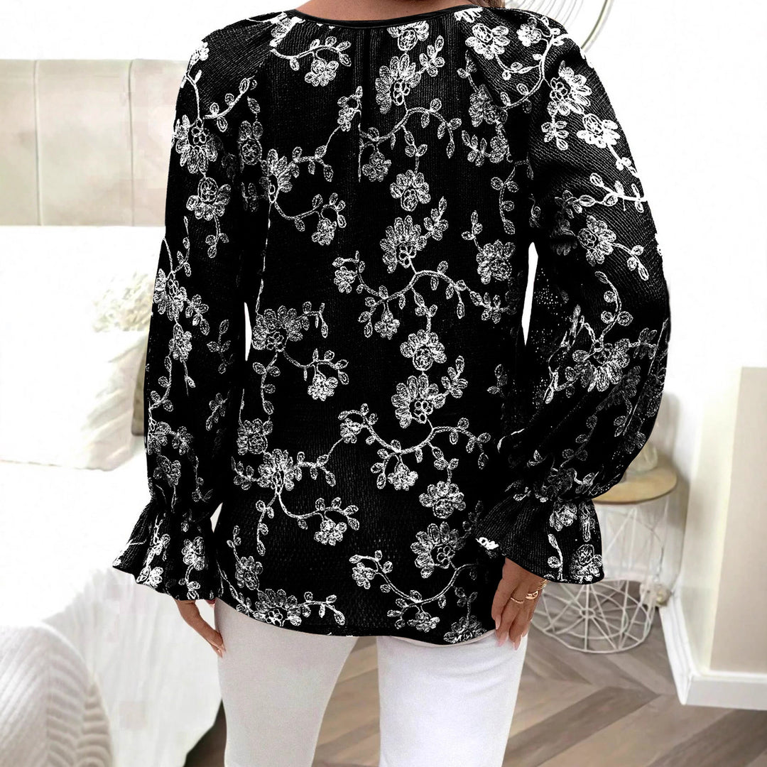 Damen V‑Neck Bluse mit floraler Stickerei, Perlenknopfleiste und Ballonärmeln – Avérine