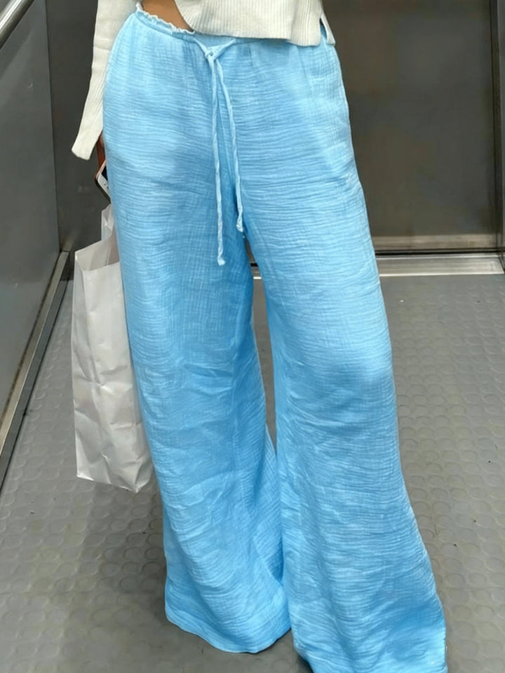 Damen Leinenhose mit lockerer, knöchellanger Passform, seitlichen Eingrifftaschen und Zierknopf-Details – Avélisse