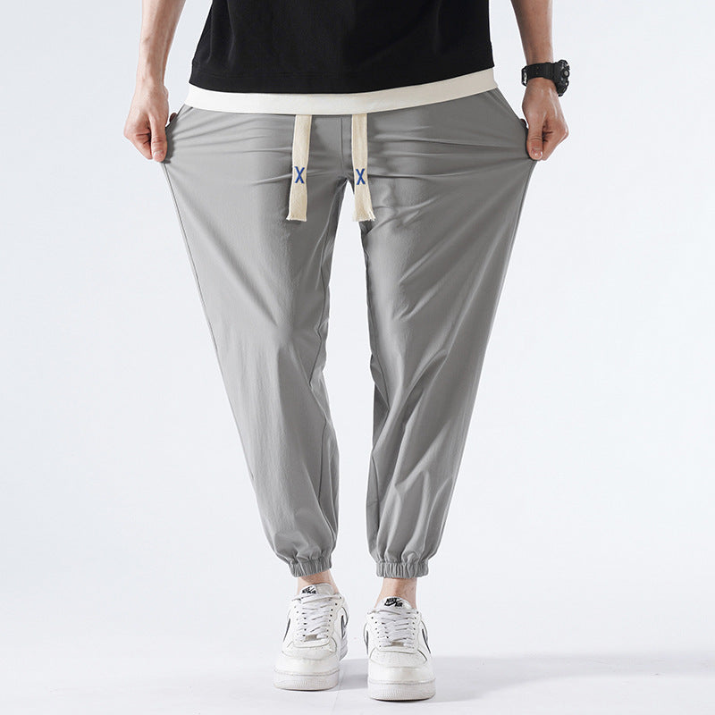 Herren Leichte Relax-Fit-Loungehose aus atmungsaktivem Jersey mit elastischem Tunnelbund, breitem Kordelzug & geripptem Beinabschluss Echoarchiv