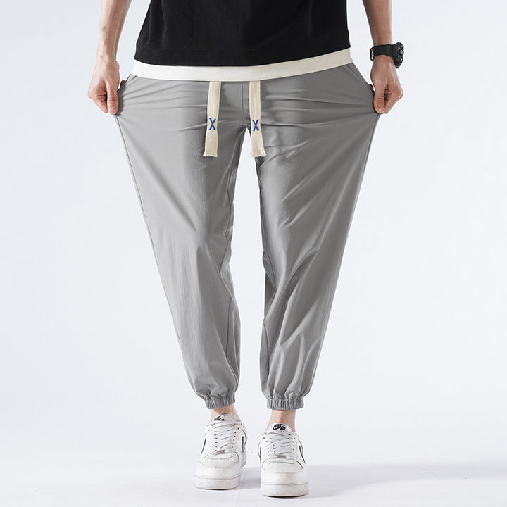 Herren Leichte Relax-Fit-Loungehose aus atmungsaktivem Jersey mit elastischem Tunnelbund, breitem Kordelzug & geripptem Beinabschluss Echoarchiv