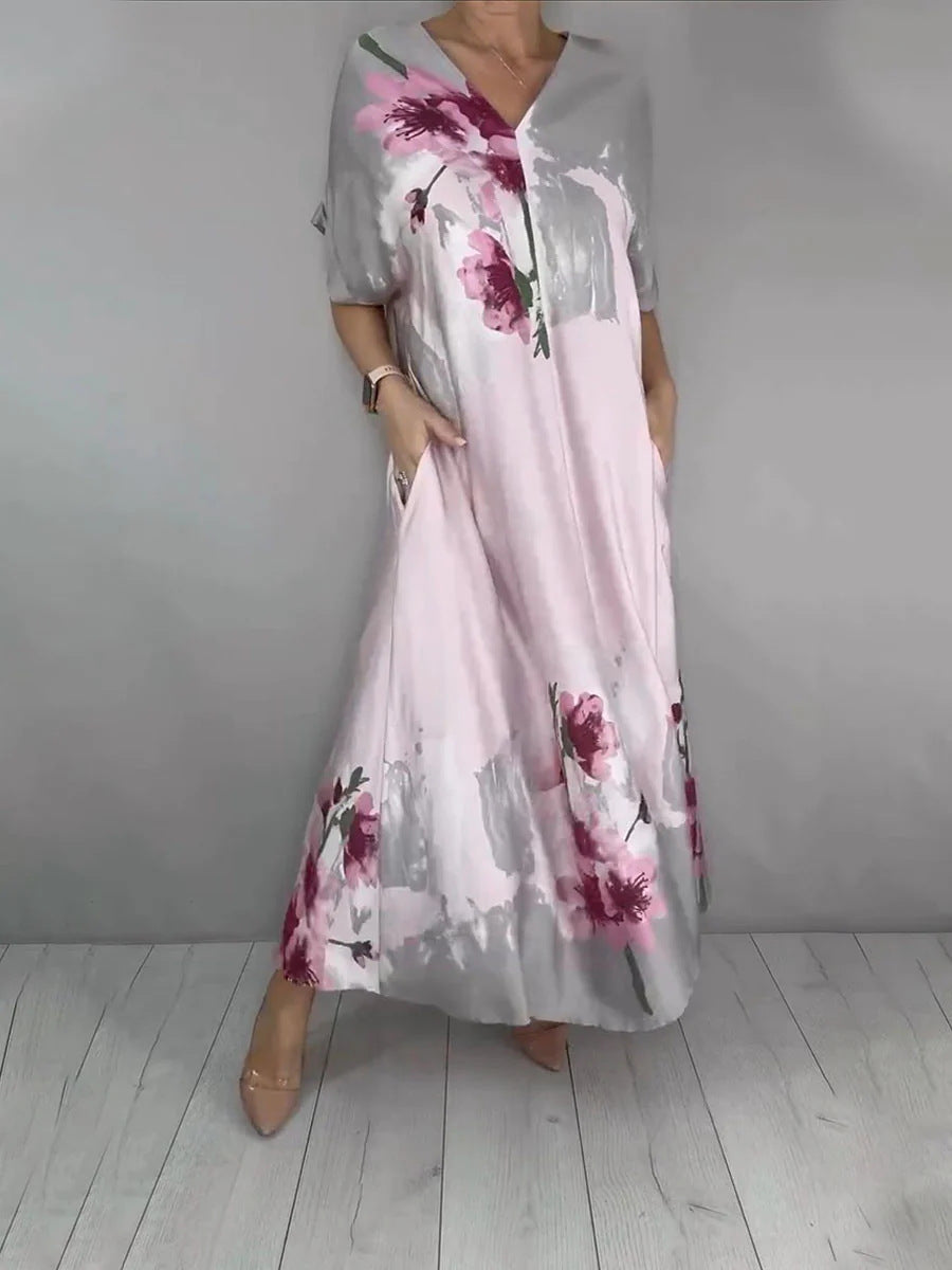 Damen Maxikleid mit weitem Fall, V-Ausschnitt, Eingrifftaschen und floraler Aquarelloptik Echoarchiv