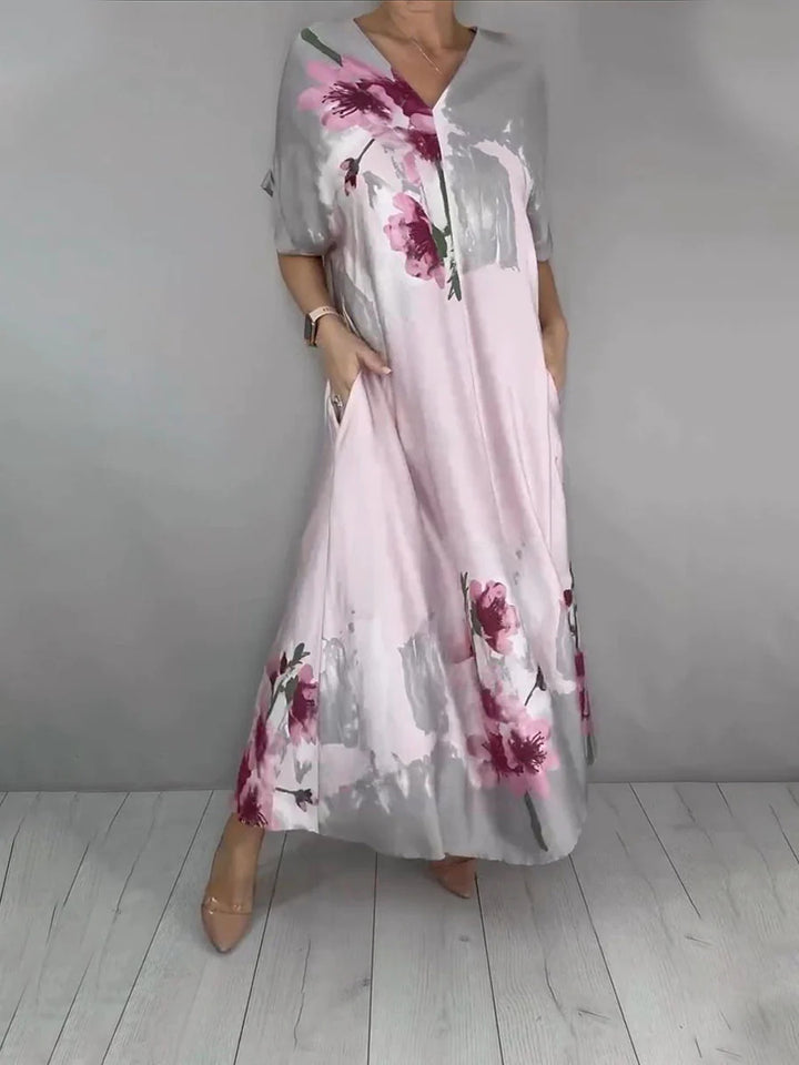 Damen Maxikleid mit weitem Fall, V-Ausschnitt, Eingrifftaschen und floraler Aquarelloptik Echoarchiv