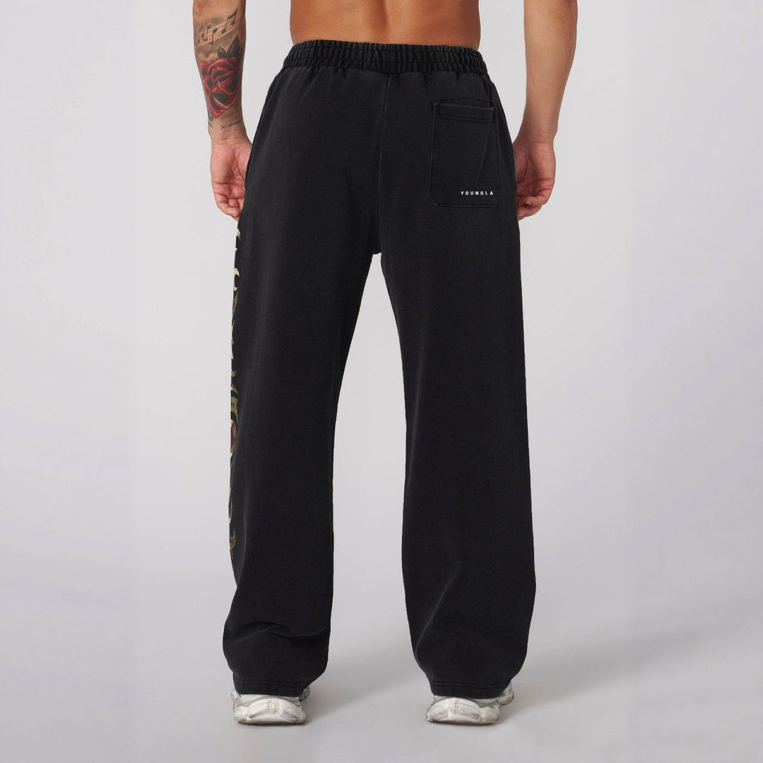 Herren nan weite Jogginghose mit elastischem Bund, Seitentaschen und detailreichem Schädel- und Rosenmotiv Echo Archiv