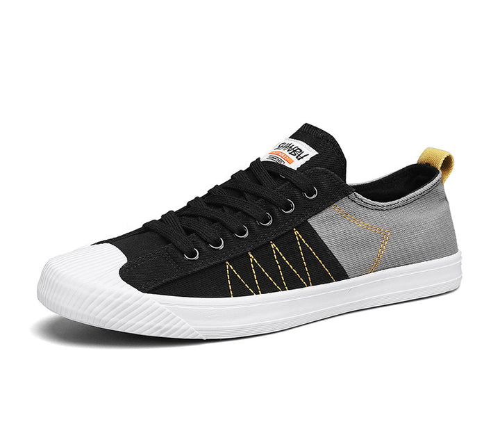 Unisex niedrige Canvas-Sneaker mit verstärkter Gummi-Zehenkappe und kontrastierenden Textilpaneelen – Norré