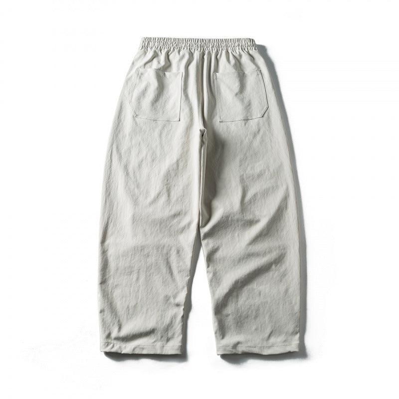 Unisex Weite Cropped-Hose mit Tunnelzug, elastischem Bund und markanten Nahtpaneelen Echo Archiv